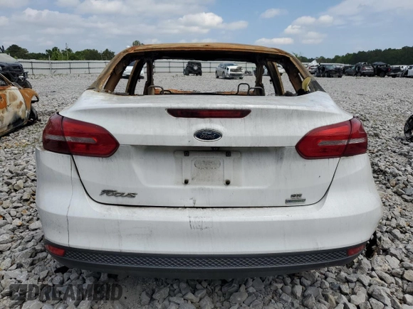 2018 Ford Focus SE z VIN 1FADP3FE4JL265608, wystawiony jako Copart lot #50029575 z przebiegiem Nie podano mil oraz Szkoda całkowita • Salvage title. Historia ofert i sprzedaży dostępna na DreamBid. Obrazek 6.