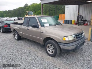 2003 Mazda B-Series 2WD Truck SE with VIN 4F4YR46VX3TM16294, listed as a IAAI auction lot 42034107 with 165,007 mi miles. Bid and sale history available at carsss.com. Image 1.