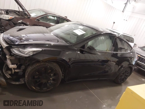 2021 Tesla Model Y Long Range with VIN 5YJYGAEE5MF305655, listed as a IAAI auction lot 41860993 with 50,750 mi miles. Bid and sale history available at carsss.com. Image 14.