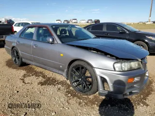 1999 Nissan Skyline z VIN HR34005885, wystawiony jako Copart lot #75422984 z przebiegiem 150 776 mil mil oraz Szkoda całkowita • Salvage title. Historia ofert i sprzedaży dostępna na DreamBid. Obrazek 4.