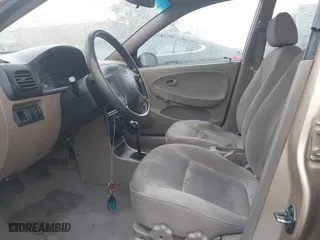 2002 Kia Rio with VIN KNADC123626192611, listed as a IAAI auction lot 41765104 with 62,387 mi miles. Bid and sale history available at carsss.com. Image 5.