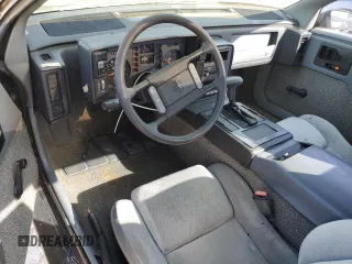 1988 Pontiac Fiero z VIN 1G2PE11R1JP219470, wystawiony jako Copart lot #77772864 z przebiegiem 94 011 mil mil oraz Szkody całkowita. Historia ofert i sprzedaży dostępna na DreamBid. Obrazek 8.