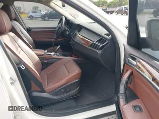 2011 BMW X5 35i with VIN 5UXZV4C54BL412770, listed as a IAAI auction lot 41618946 with 148,612 mi miles. Bid and sale history available at carsss.com. Image 5.