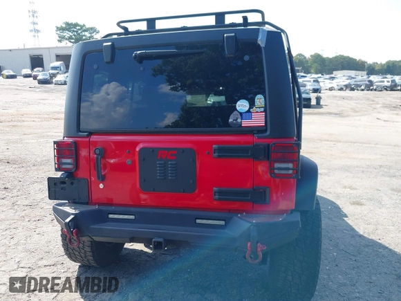 2016 Jeep Wrangler Unlimited Rubicon with VIN 1C4HJWFG7GL128994, listed as a IAAI auction lot 40503403 with 85,950 mi miles. Bid and sale history available at carsss.com. Image 16.
