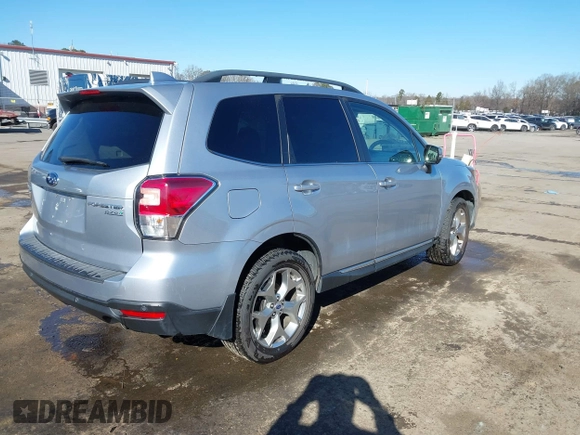 2017 Subaru Forester Touring with VIN JF2SJAWC8HH532348, listed as a IAAI auction lot 41304804 with 104,221 mi miles and . Bid and sale history available at DreamBid. Image 4.