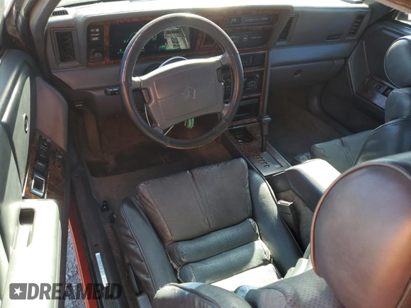 1989 Chrysler LeBaron z VIN 1C3XJ55J9KG275438, wystawiony jako Copart lot #73026764 z przebiegiem 118 347 mil mil oraz Tytuł czysty. Historia ofert i sprzedaży dostępna na DreamBid. Obrazek 8.