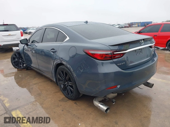2021 Mazda 6 Carbon Edition with VIN JM1GL1WY0M1600414, listed as a IAAI auction lot 41551393 with 36,780 mi miles and . Bid and sale history available at DreamBid. Image 3.