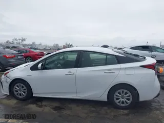 2021 Toyota Prius L Eco with VIN JTDKAMFU6M3141019, listed as a IAAI auction lot 41821212 with 202,756 mi miles. Bid and sale history available at carsss.com. Image 14.