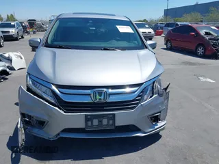 2018 Honda Odyssey Touring with VIN 5FNRL6H81JB022975, listed as a IAAI auction lot 42653304 with 210,137 mi miles and . Bid and sale history available at DreamBid. Image 13.
