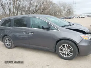 2012 Honda Odyssey EX-L with VIN 5FNRL5H60CB081866, listed as a IAAI auction lot 41835701 with 151,236 mi miles and . Bid and sale history available at DreamBid. Image 13.
