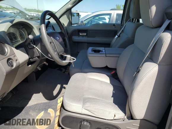 2007 Ford F-150 STX with VIN 1FTRX12W87FB51282, listed as a Copart auction lot 55580365 with 213,923 mi miles and Salvage title. Bid and sale history available at DreamBid. Image 7.