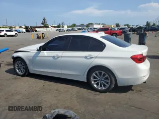 2018 BMW 3 Series 320i xDrive with VIN WBA8A3C55JA357532, listed as a Copart auction lot 57561015 with 46,876 mi miles and Salvage title. Bid and sale history available at DreamBid. Image 2.