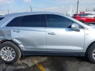 2017 Cadillac XT5 FWD with VIN 1GYKNARS7HZ144148, listed as a IAAI auction lot 41392399 with 96,252 mi miles and . Bid and sale history available at carsss.com. Image 13.
