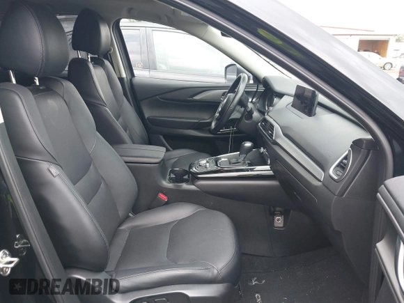 2023 Mazda CX-9 Touring Plus with VIN JM3TCBAY2P0657825, listed as a IAAI auction lot 42756562 with 52,090 mi miles and . Bid and sale history available at DreamBid. Image 5.