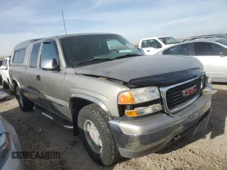 2000 GMC New Sierra 1500 SLE with VIN 2GTEK19T7Y1310097, listed as a Copart auction lot 84557764 with 257,060 mi miles and Salvage Title. Bid and sale history available at carsss.com. Image 4.