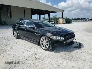2014 Jaguar XJ Portfolio z VIN SAJWA2GZ4E8V60864, wystawiony jako Copart lot #76478674 z przebiegiem 50 578 mil mil oraz Szkoda całkowita • Salvage title. Historia ofert i sprzedaży dostępna na DreamBid. Obrazek 13.