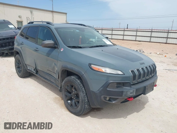 2015 Jeep Cherokee Trailhawk with VIN 1C4PJMBS0FW524479, listed as a IAAI auction lot 41908871 with 118,825 mi miles and . Bid and sale history available at DreamBid. Image 1.