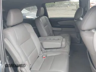 2014 Honda Odyssey Touring with VIN 5FNRL5H91EB081811, listed as a IAAI auction lot 42153920 with 16 mi miles and . Bid and sale history available at DreamBid. Image 8.