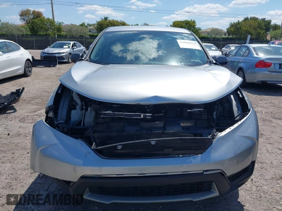 2019 Honda CR-V LX with VIN 2HKRW5H31KH411771, listed as a IAAI auction lot 42060193 with 175,036 mi miles and . Bid and sale history available at DreamBid. Image 12.