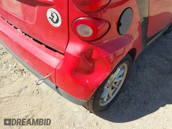 2009 Smart fortwo Pure z VIN WMEEJ31X59K291372, wystawiony jako IAAI lot #41826469 z przebiegiem 87 773 mil mil oraz . Historia ofert i sprzedaży dostępna na DreamBid. Obrazek 6.