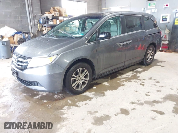 2012 Honda Odyssey EX-L with VIN 5FNRL5H63CB137198, listed as a IAAI auction lot 42706690 with 305,753 mi miles and . Bid and sale history available at DreamBid. Image 2.