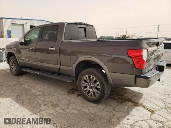 2016 Nissan Titan Pro-4X z VIN 1N6BA1F4XGN502773, wystawiony jako Copart lot #49285535 z przebiegiem 129 390 mil mil oraz Czysty tytuł • Clean title. Historia ofert i sprzedaży dostępna na DreamBid. Obrazek 2.