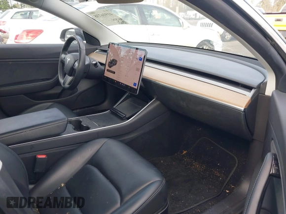 2019 Tesla Model 3 Mid Range with VIN 5YJ3E1EA4KF305611, listed as a IAAI auction lot 41916738 with 59,101 mi miles and . Bid and sale history available at carsss.com. Image 5.