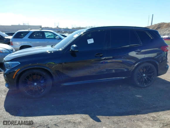 2019 BMW X5 xDrive50i with VIN 5UXJU2C5XKLN66873, listed as a IAAI auction lot 41472246 with 98,571 mi miles. Bid and sale history available at carsss.com. Image 13.