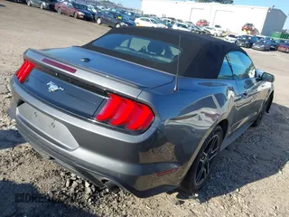 2021 Ford Mustang EcoBoost z VIN 1FATP8UH3M5105279, wystawiony jako IAAI lot #41712821 z przebiegiem 99 760 mil mil oraz . Historia ofert i sprzedaży dostępna na DreamBid. Obrazek 4.