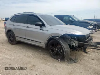 2023 Volkswagen Tiguan SE R-Line Black with VIN 3VVCB7AX5PM128335, listed as a Copart auction lot 56128305 with 21,524 mi miles and Salvage title. Bid and sale history available at DreamBid. Image 4.
