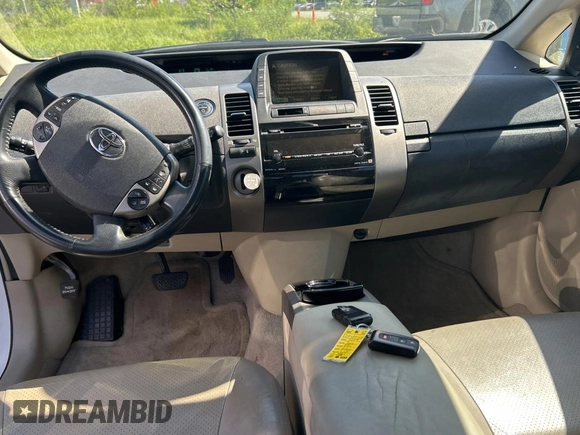 2007 Toyota Prius z VIN JTDKB20U477546822, wystawiony jako Copart lot #61691805 z przebiegiem 146 754 mil mil oraz Czysty tytuł • Clean title. Historia ofert i sprzedaży dostępna na DreamBid. Obrazek 9.