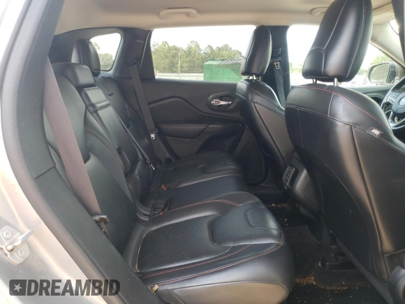 2016 Jeep Cherokee Trailhawk z VIN 1C4PJMBSXGW121272, wystawiony jako Copart lot #61769505 z przebiegiem 119 353 mil mil oraz Szkoda całkowita • Salvage title. Historia ofert i sprzedaży dostępna na DreamBid. Obrazek 11.