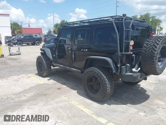 2012 Jeep Wrangler Unlimited Altitude with VIN 1C4HJWEG5CL161049, listed as a IAAI auction lot 42629330 with 217,147 mi miles and . Bid and sale history available at DreamBid. Image 3.