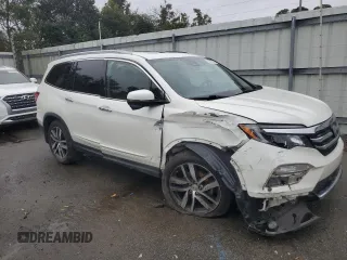 2017 Honda Pilot Touring with VIN 5FNYF6H99HB025600, listed as a Copart auction lot 88131475 with 131,939 mi miles and Salvage Title. Bid and sale history available at DreamBid. Image 4.