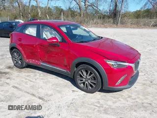 2016 Mazda CX-3 Grand Touring with VIN JM1DKFD72G0129096, listed as a IAAI auction lot 41592893 with 144,860 mi miles. Bid and sale history available at carsss.com. Image 1.