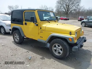 2000 Jeep Wrangler Sport with VIN 1J4FA49S2YP768451, listed as a IAAI auction lot 42136785 with 74,492 mi miles. Bid and sale history available at carsss.com. Image 1.