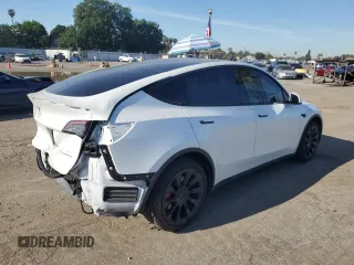 2022 Tesla Model Y Long Range with VIN 7SAYGDEE1NF339663, listed as a Copart auction lot 49771965 with 33,734 mi miles and Salvage Title. Bid and sale history available at carsss.com. Image 3.
