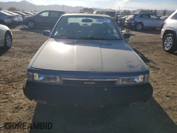 1989 Toyota Camry z VIN JT2SV21E8K0314703, wystawiony jako Copart lot #76053194 z przebiegiem 124 873 mil mil oraz Nie do naprawy • Non repairable. Historia ofert i sprzedaży dostępna na DreamBid. Obrazek 5.