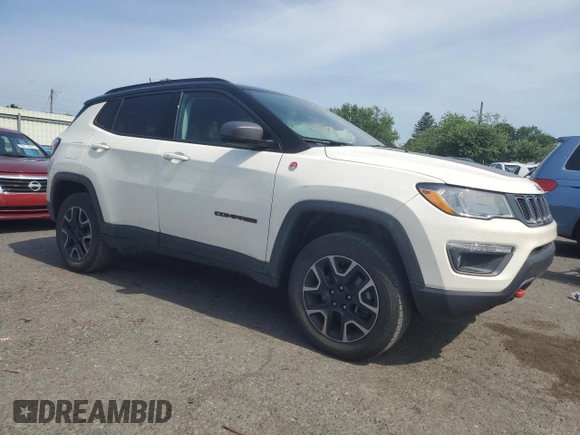 2019 Jeep Compass Trailhawk with VIN 3C4NJDDB5KT647778, listed as a Copart auction lot 62032515 with 51,505 mi miles and Salvage title. Bid and sale history available at DreamBid. Image 4.