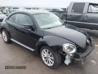 2017 Volkswagen Beetle 1.8T SE with VIN 3VWJ17AT9HM618202, listed as a IAAI auction lot 41562078 with 101,808 mi miles. Bid and sale history available at carsss.com. Image 1.