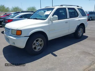 1999 Isuzu Rodeo S with VIN 4S2CK58W7X4325703, listed as a IAAI auction lot 42715480 with 205,420 mi miles and . Bid and sale history available at DreamBid. Image 2.