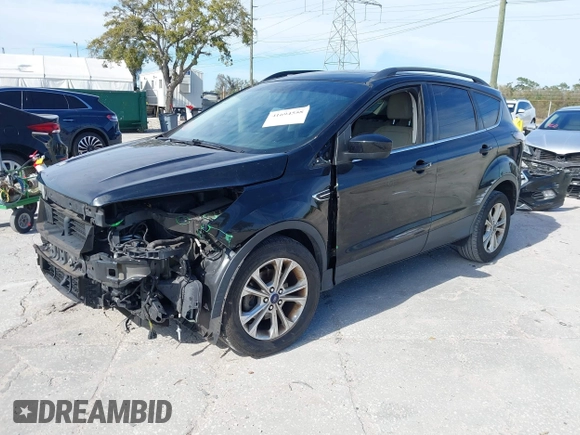 2017 Ford Escape SE with VIN 1FMCU0GDXHUB56573, listed as a IAAI auction lot 41694558 with 145,902 mi miles. Bid and sale history available at carsss.com. Image 2.