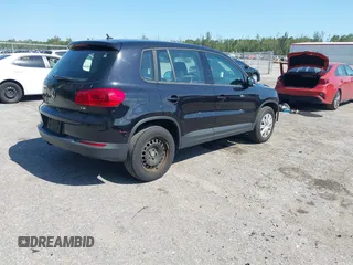 2017 Volkswagen Tiguan S with VIN WVGAV7AX5HK048843, listed as a IAAI auction lot 42029583 with 73,892 mi miles and . Bid and sale history available at DreamBid. Image 4.