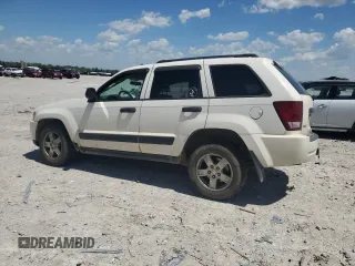 2005 Jeep Grand Cherokee Laredo with VIN 1J4GR48K05C625144, listed as a Copart auction lot 57477275 with 167,654 mi miles and Salvage title. Bid and sale history available at DreamBid. Image 2.