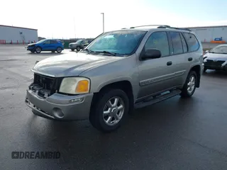 2003 GMC Envoy SLT with VIN 1GKDT13S532308502, listed as a IAAI auction lot 41676188 with 218,626 mi miles. Bid and sale history available at carsss.com. Image 2.