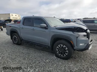 2024 Nissan Frontier PRO-4X with VIN 1N6ED1EK8RN659581, listed as a Copart auction lot 44911715 with 6,215 mi miles and Salvage Title. Bid and sale history available at carsss.com. Image 4.