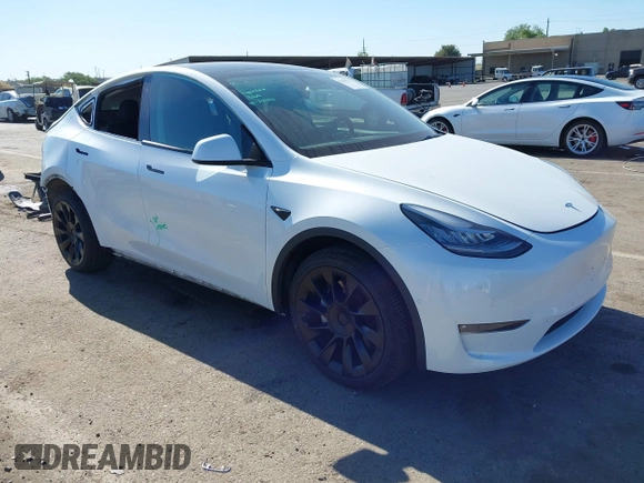 2022 Tesla Model Y Long Range with VIN 7SAYGDEE1NF364241, listed as a IAAI auction lot 42190272 with 54,878 mi miles and . Bid and sale history available at DreamBid. Image 1.