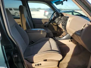 1997 Ford Explorer XL with VIN 1FMDU34E5VZB40878, listed as a Copart auction lot 84009744 with 185,047 mi miles and Salvage title. Bid and sale history available at DreamBid. Image 7.