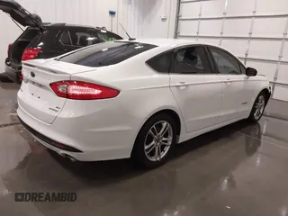 2015 Ford Fusion SE Hybrid with VIN 3FA6P0LU8FR215788, listed as a IAAI auction lot 42038194 with 136,949 mi miles and . Bid and sale history available at DreamBid. Image 4.
