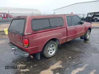 1998 Mazda B-Series 2WD Truck SE with VIN 4F4YR16C5WTM35045, listed as a IAAI auction lot 41655123 with 242,946 mi miles. Bid and sale history available at carsss.com. Image 4.